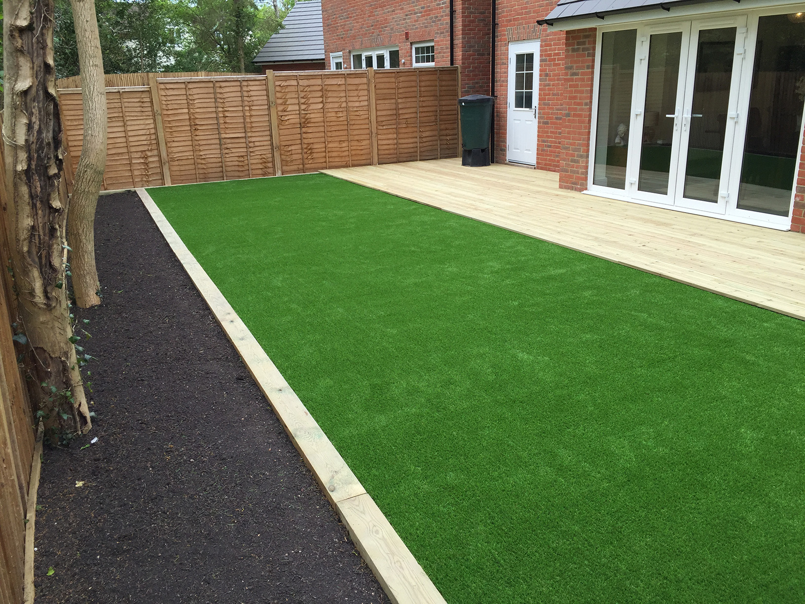 Artificial lawn membrane and base layer