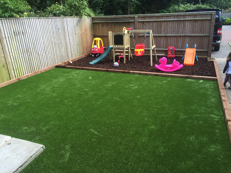 Bark play area alongside artificial lawn